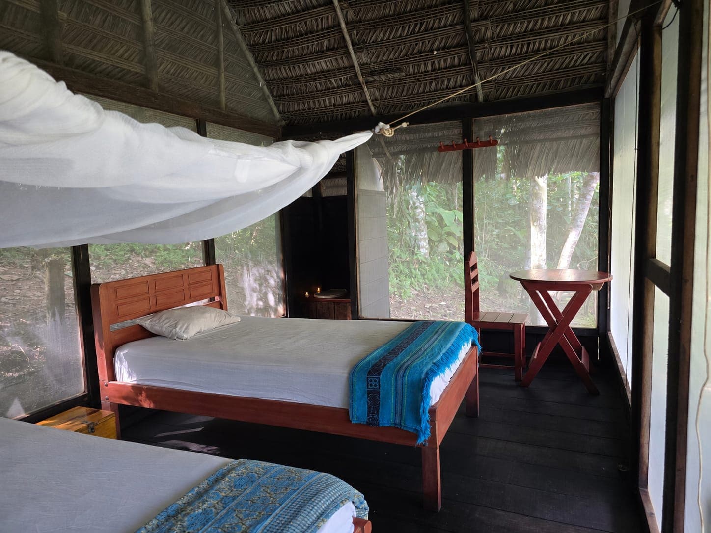 Two-person tambo interior with two beds at Dreamglade